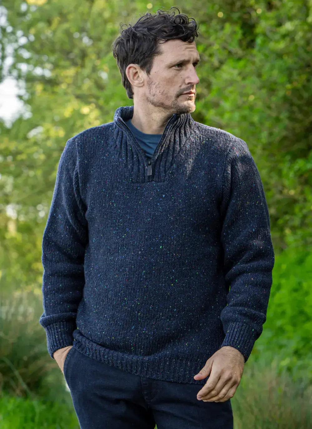 Man wearing navy Glenstone Contrast half zip sweater walking on nature path